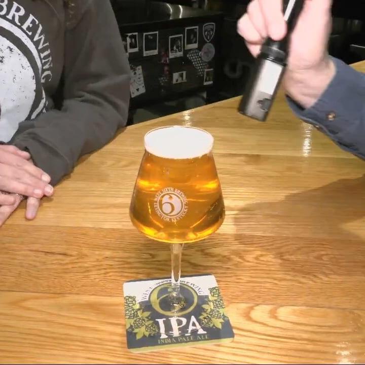 Keith Kaiser samples some beer ahead of NULU's Bock and Wurst Fest